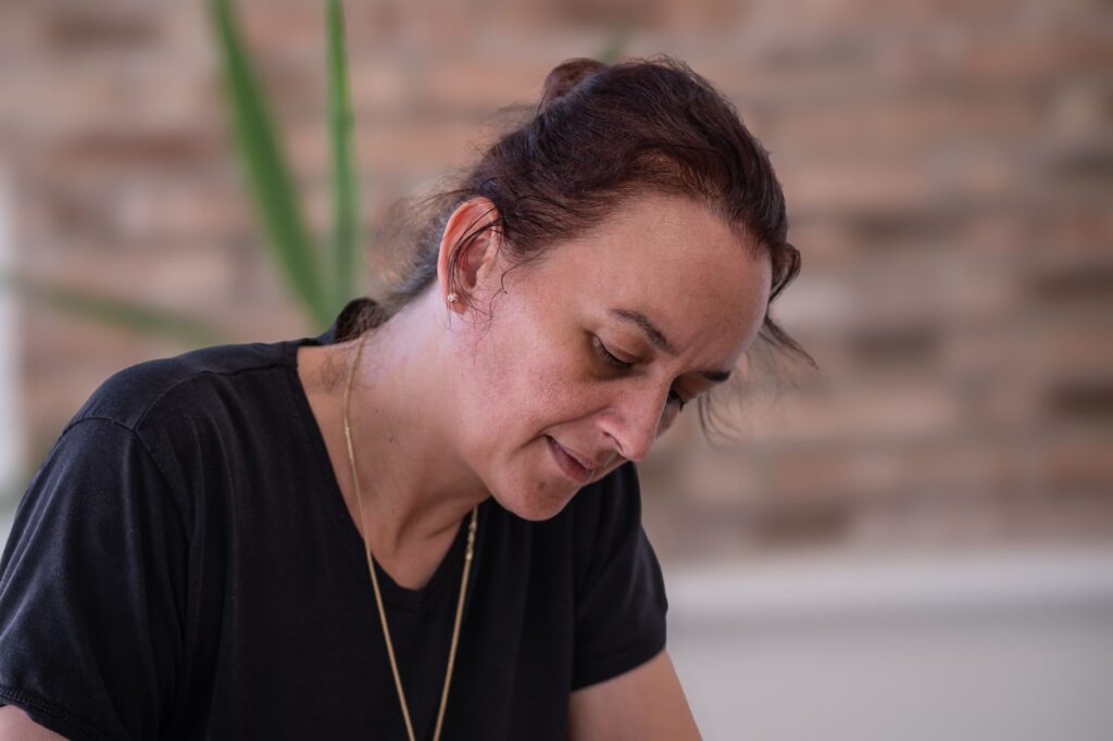 Portrait of a focused woman working indoors in İzmir, Türkiye. Captured with soft lighting.