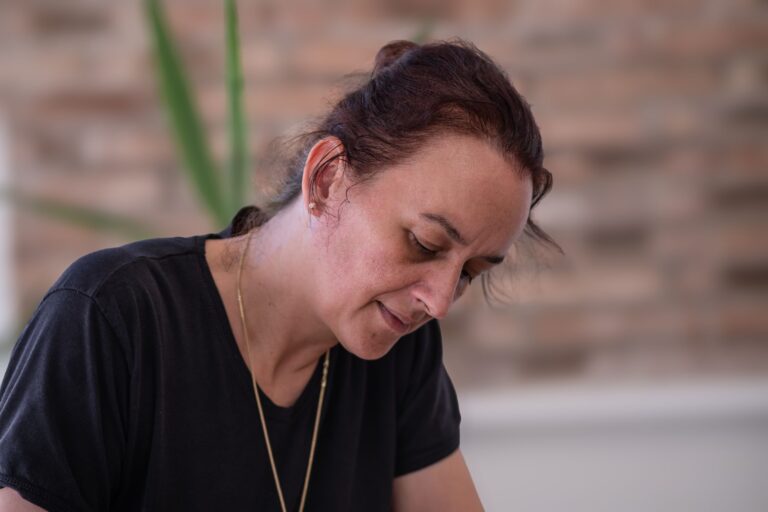 Portrait of a focused woman working indoors in İzmir, Türkiye. Captured with soft lighting.